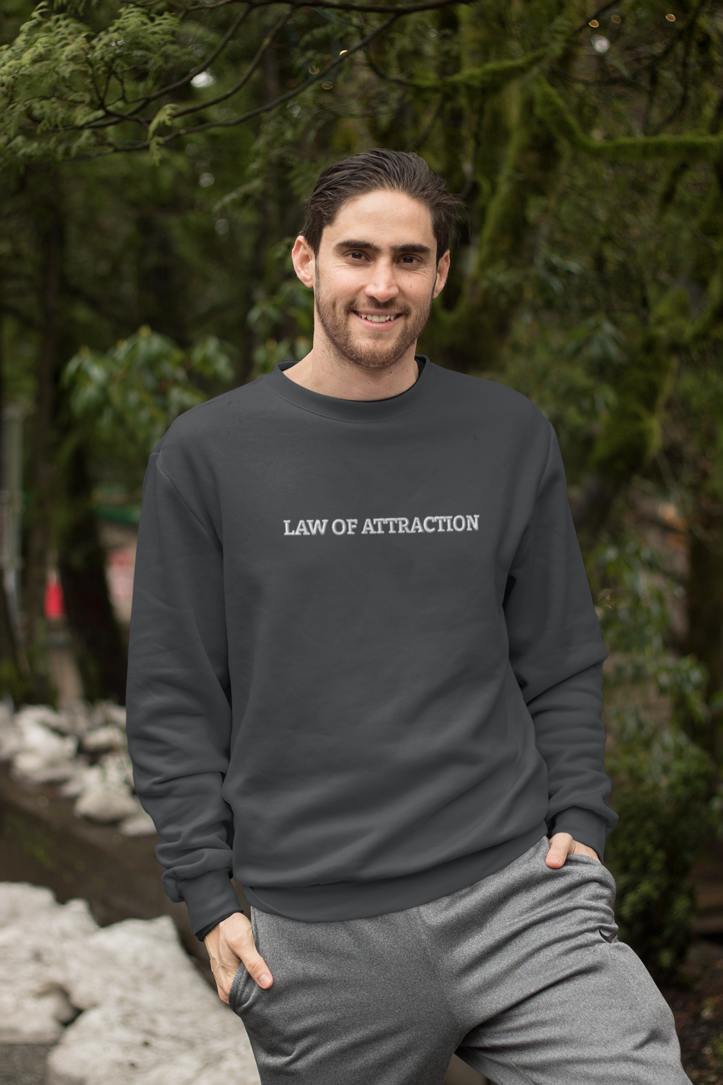 "LAW OF ATTRACTION" Design With White Embroidered Text. Classic Unisex Crewneck Sweatshirt Premium Quality Original Clothing. Wear Your Motivation