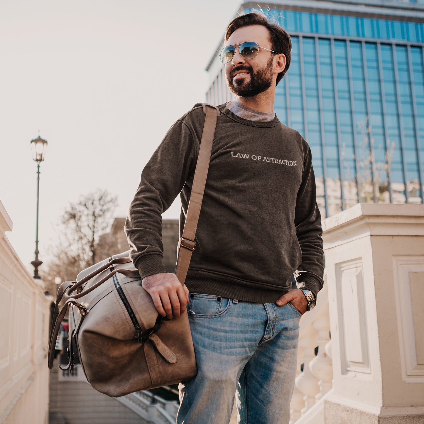 "LAW OF ATTRACTION" Design With White Embroidered Text. Classic Unisex Crewneck Sweatshirt Premium Quality Original Clothing. Wear Your Motivation