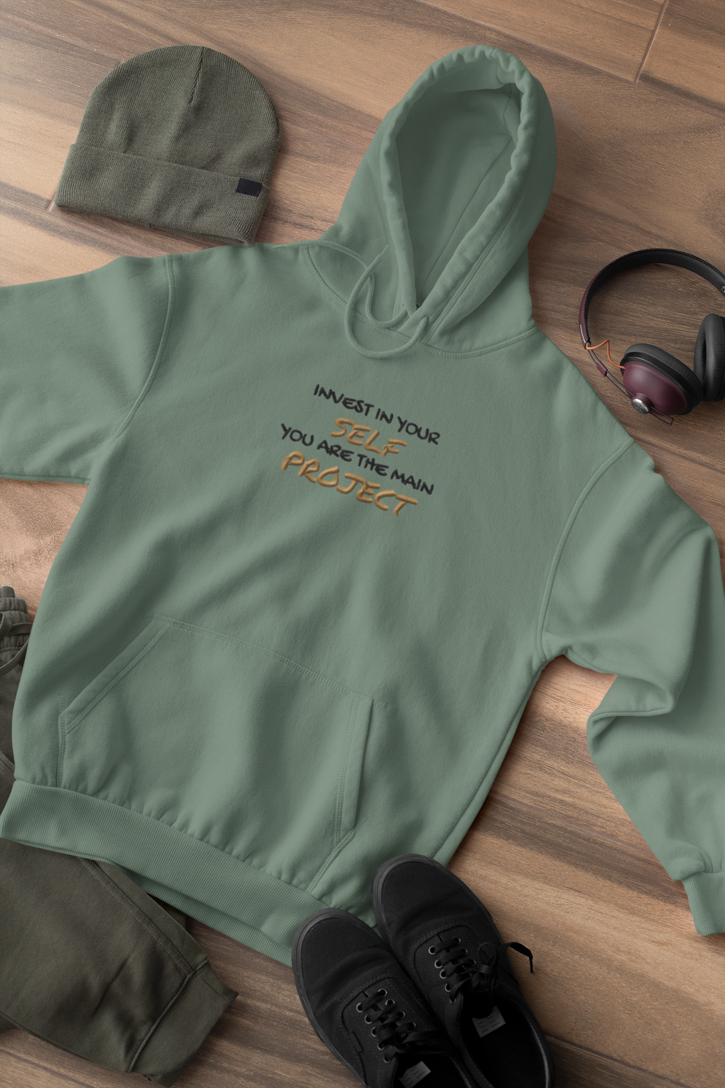 "INVEST IN YOURSELF YOU ARE THE MAIN PROJECT." Design With Gold Black Embroidered Text. Classic Unisex Pullover Hoodie Premium Quality Original Clothing. Wear Your Motivation