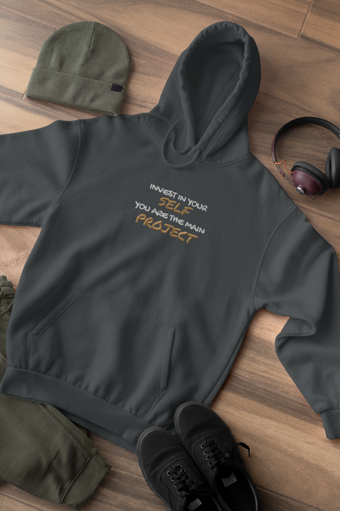 "INVEST IN YOURSELF YOU ARE THE MAIN PROJECT." Design With Gold White Embroidered Text. Classic Unisex Pullover Hoodie Premium Quality Original Clothing. Wear Your Motivation.