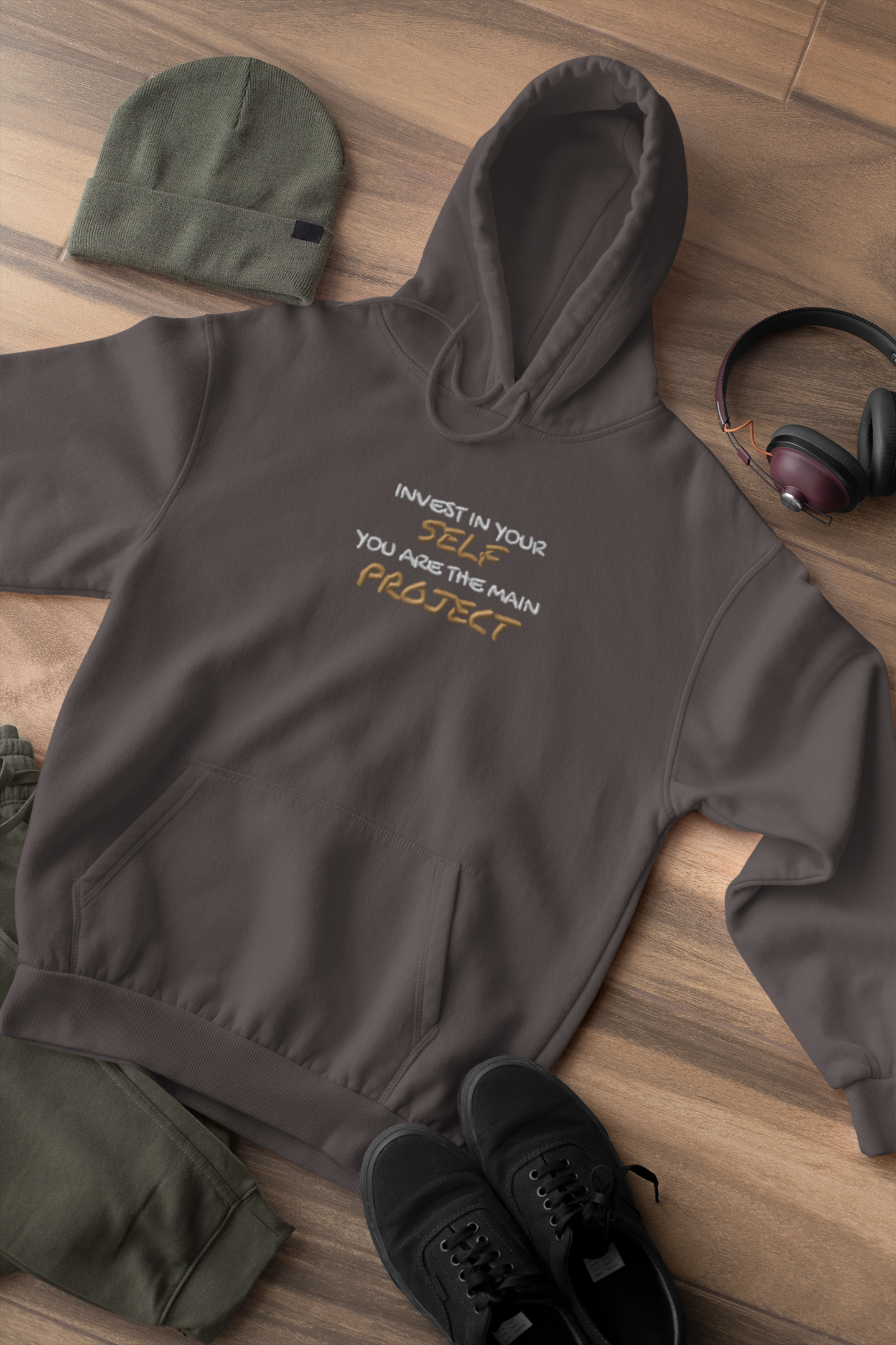 "INVEST IN YOURSELF YOU ARE THE MAIN PROJECT." Design With Gold White Embroidered Text. Classic Unisex Pullover Hoodie Premium Quality Original Clothing. Wear Your Motivation.