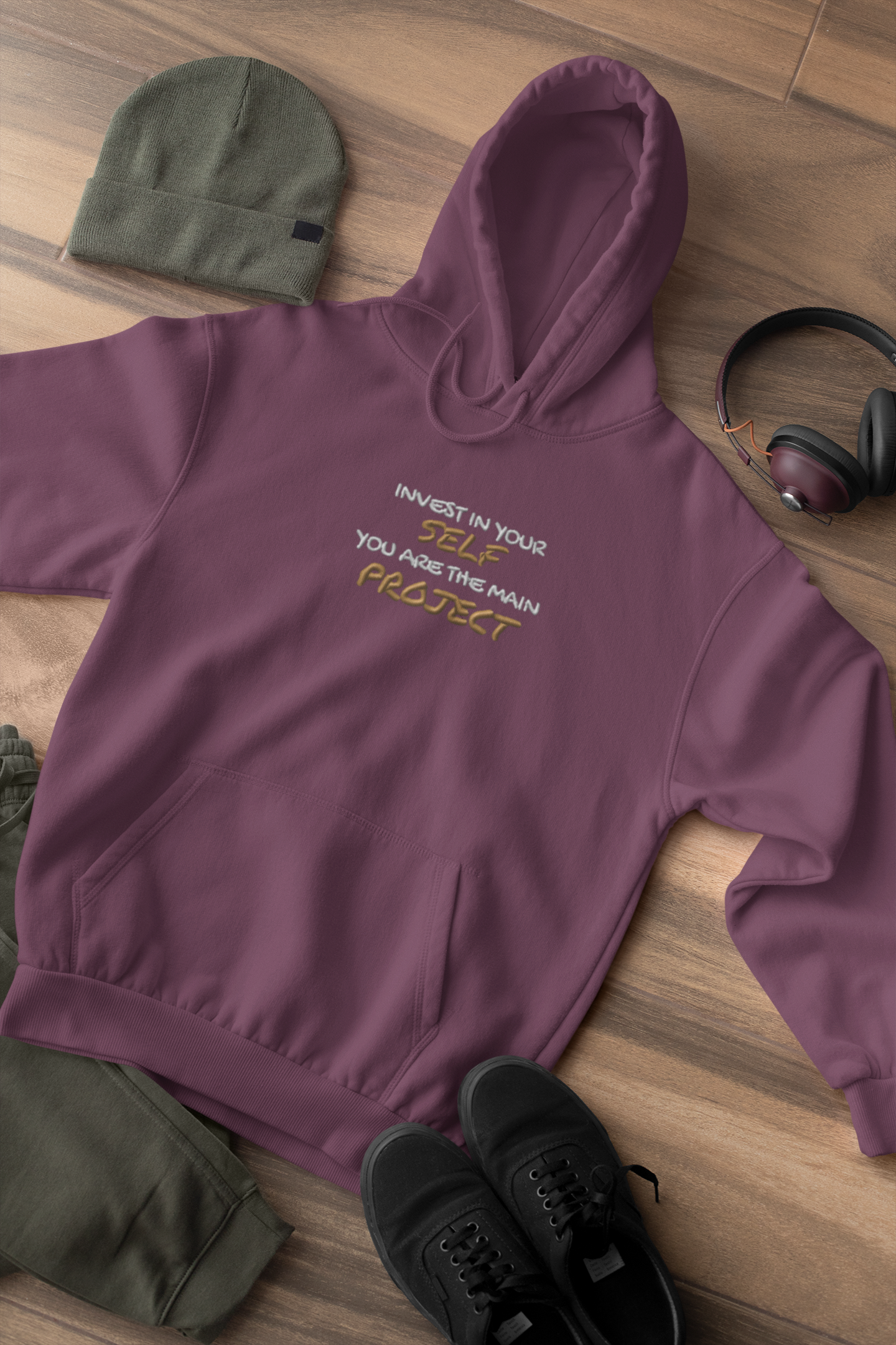 "INVEST IN YOURSELF YOU ARE THE MAIN PROJECT." Design With Gold White Embroidered Text. Classic Unisex Pullover Hoodie Premium Quality Original Clothing. Wear Your Motivation.