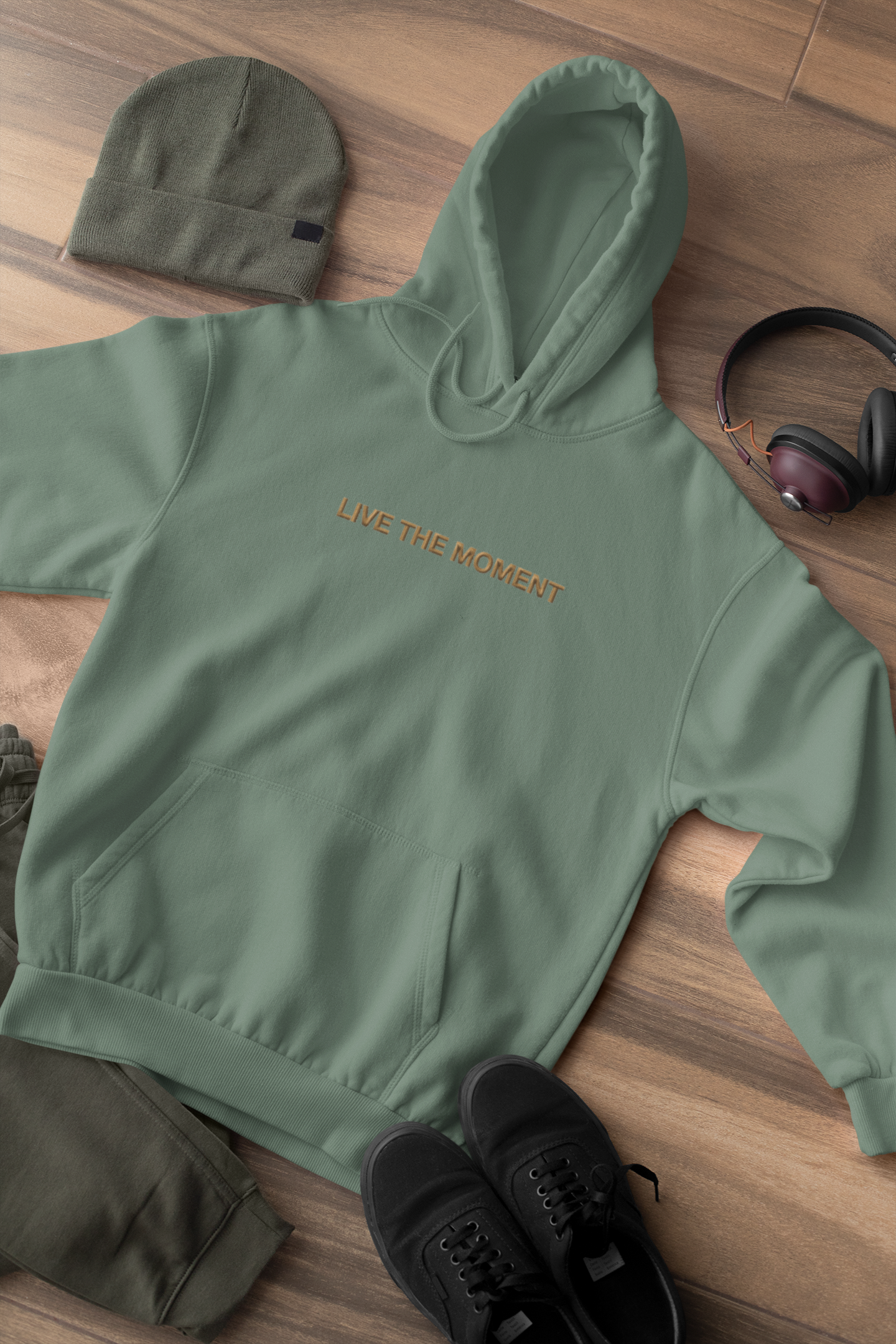 "LIVE THE MOMENT" Design With Gold Embroidered Text. Classic Unisex Pullover Hoodie Premium Quality Original Clothing. Wear Your Motivation