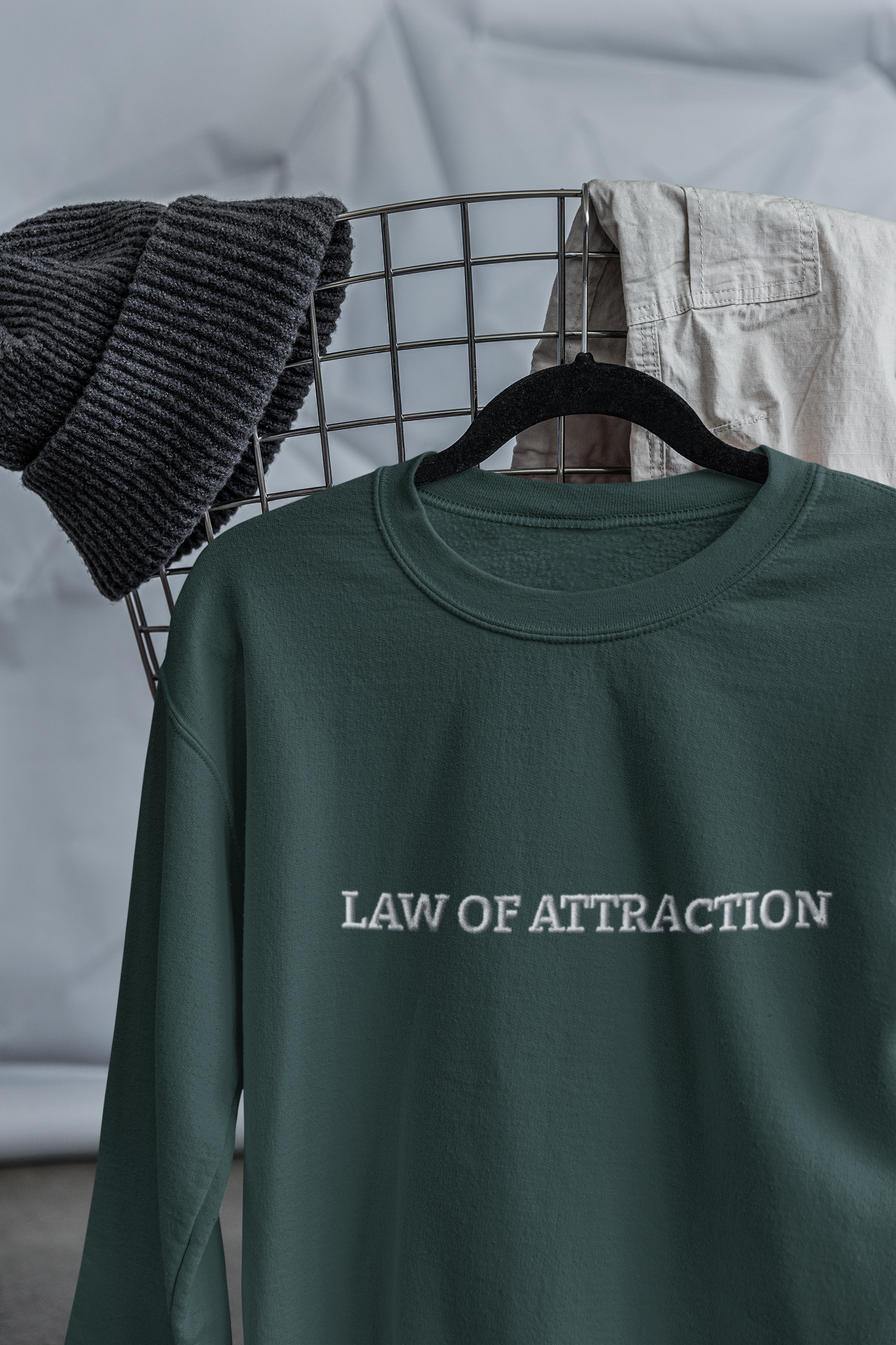 "LAW OF ATTRACTION" Design With White Embroidered Text. Classic Unisex Crewneck Sweatshirt Premium Quality Original Clothing. Wear Your Motivation