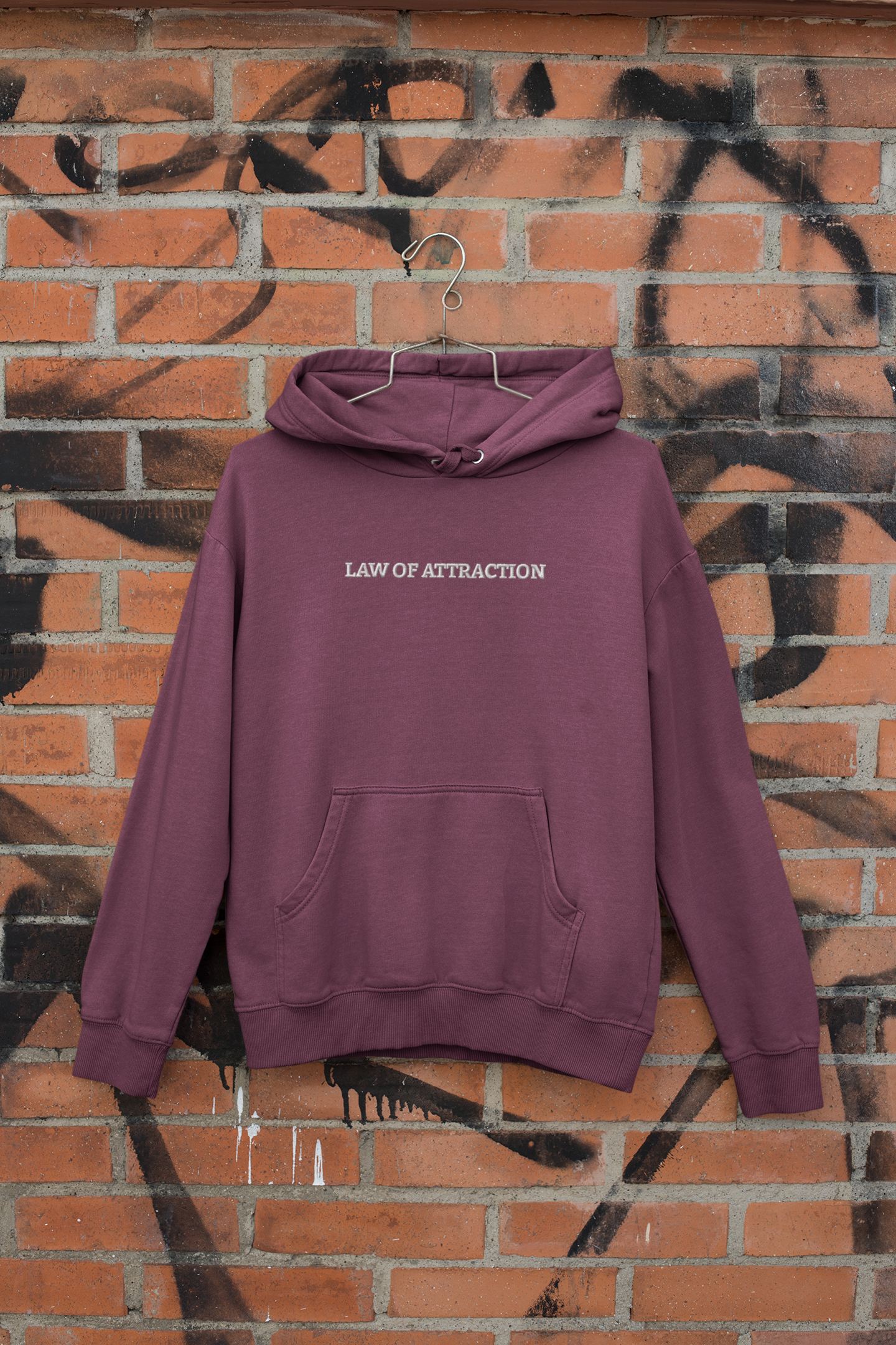 "LAW OF ATTRACTION" Design With White Embroidered Text. Classic Unisex Pullover Hoodie Premium Quality Original Clothing. Wear Your Motivation