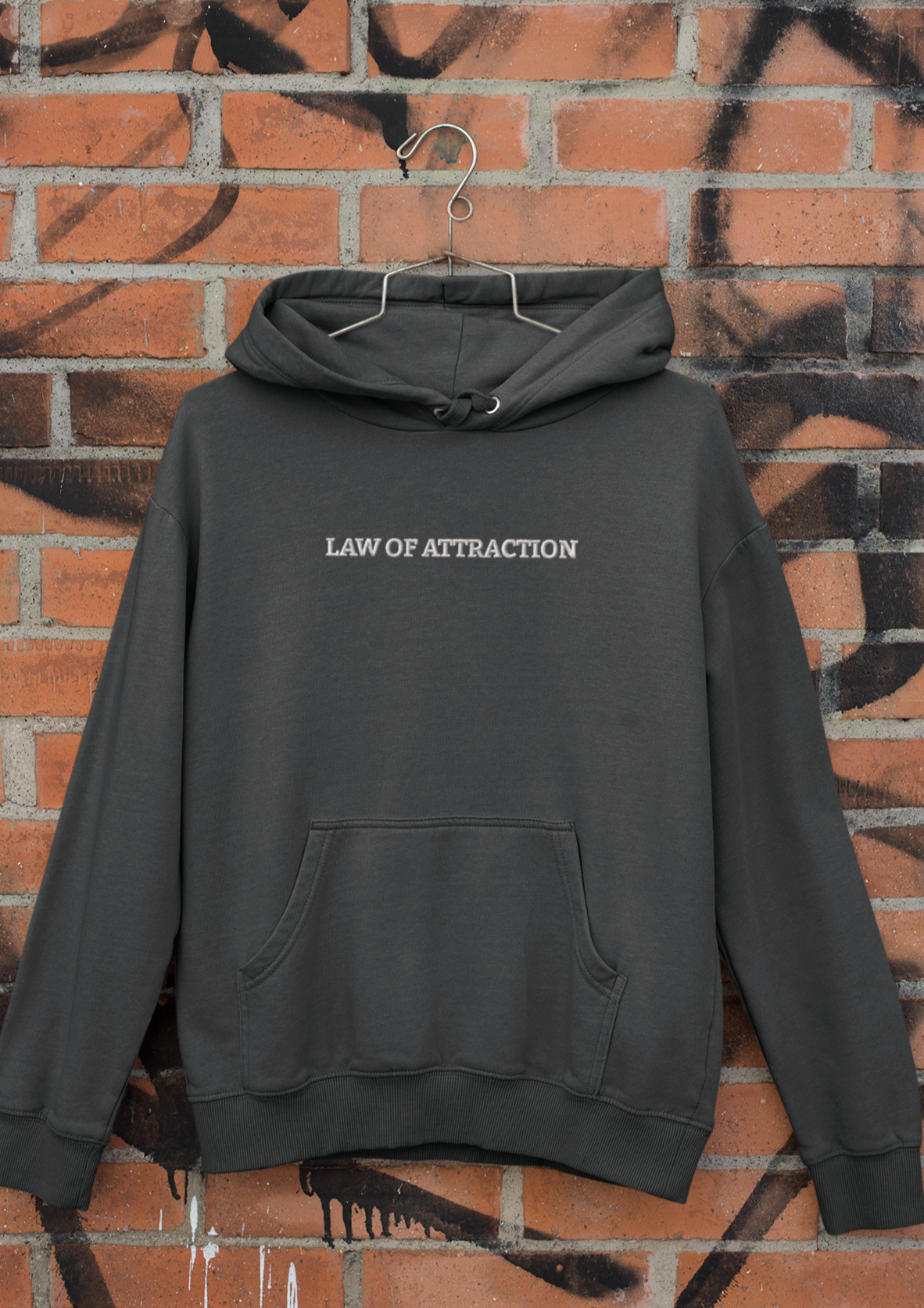 "LAW OF ATTRACTION" Design With White Embroidered Text. Classic Unisex Pullover Hoodie Premium Quality Original Clothing. Wear Your Motivation