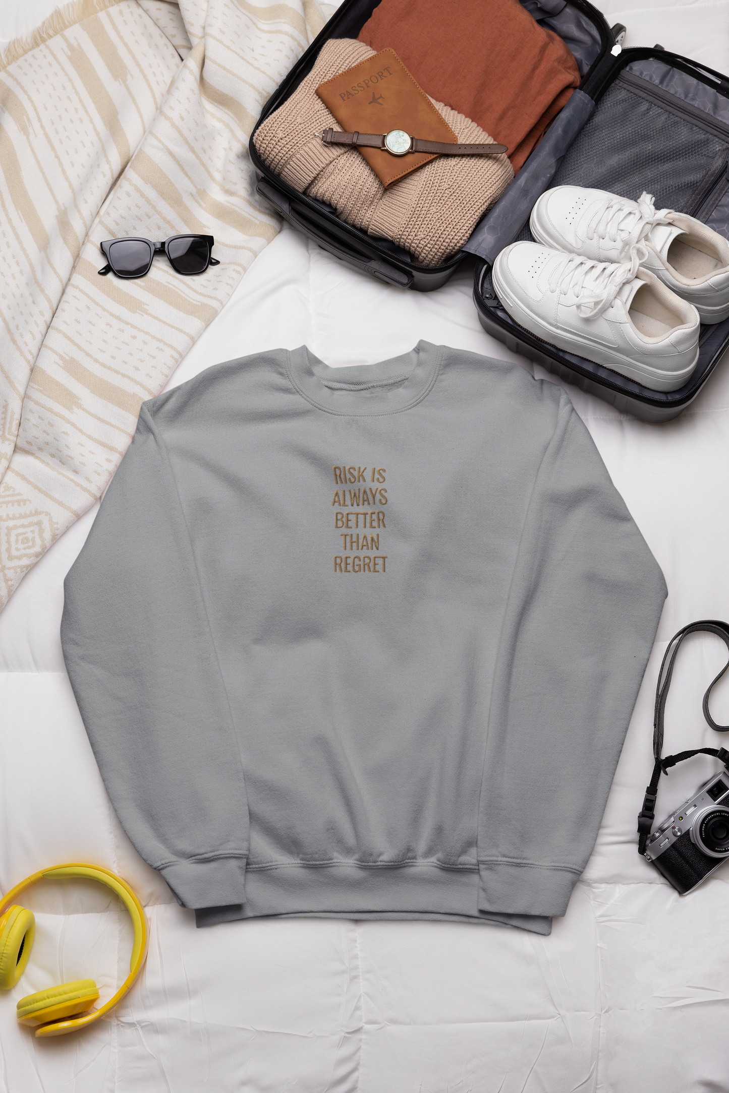 "RISK IS ALWAYS BETTER THAN REGRET" Design With Gold Embroidered Text.Classic Unisex Crewneck Sweatshirt Premium Quality Original Clothing. Wear Your Motivation.