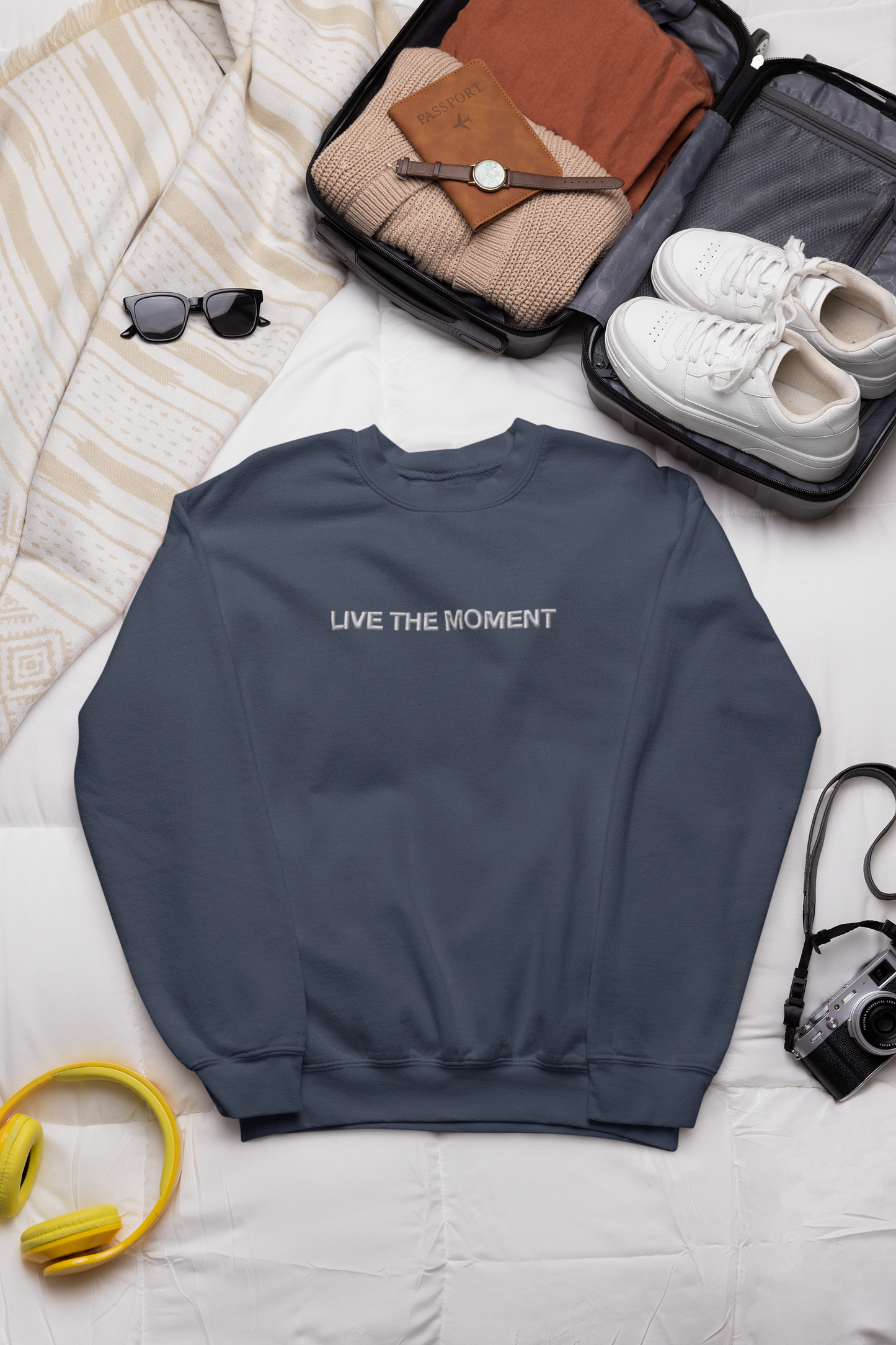 "LIVE THE MOMENT" Design With White Embroidered Text.Classic Unisex Crewneck Sweatshirt Premium Quality Original Clothing. Wear Your Motivation.