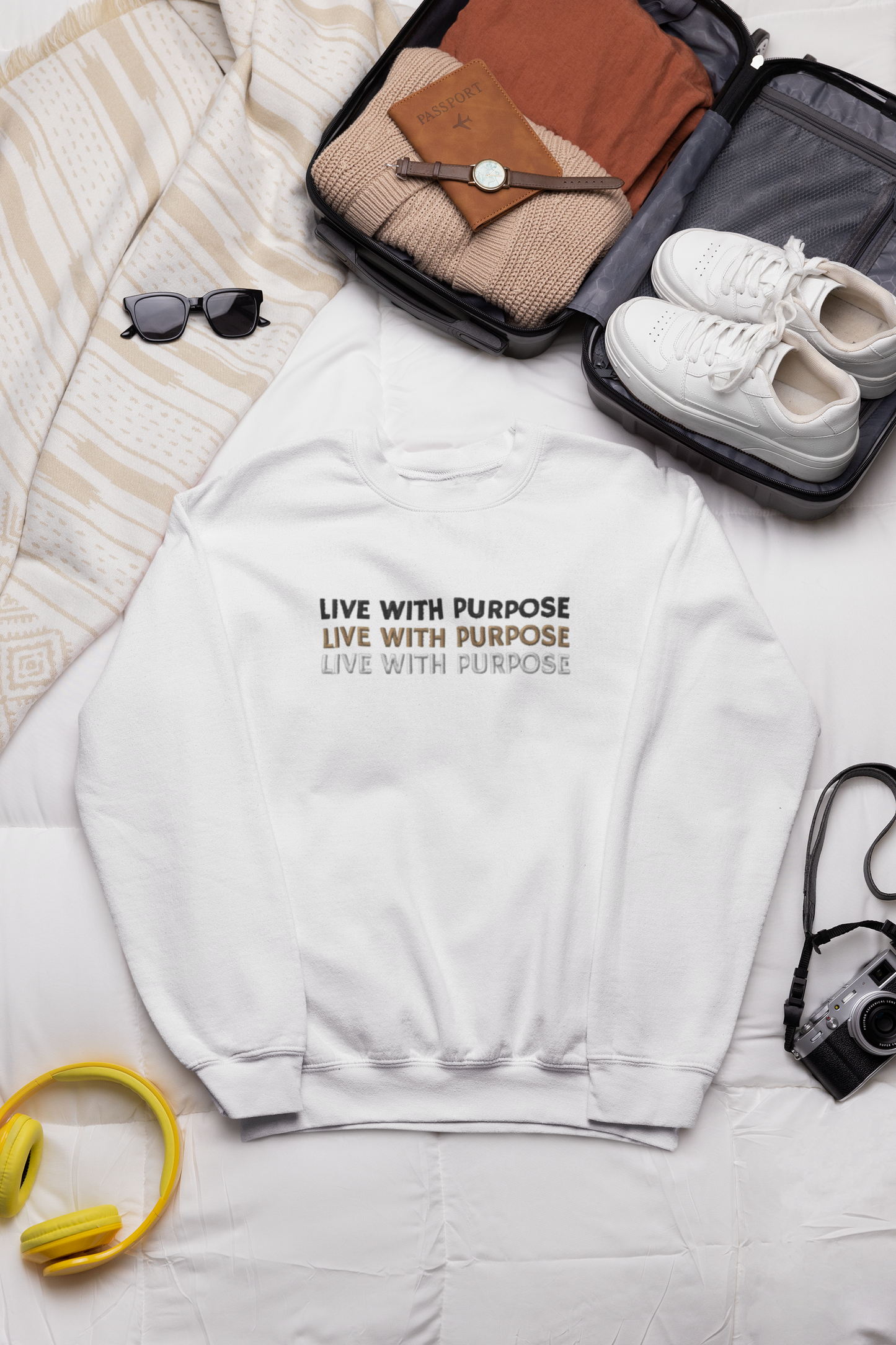 "LIVE WITH PURPOSE" Design With Gold Black White Embroidered Text. Classic Unisex Crewneck Sweatshirt Premium Quality Original Clothing. Wear Your Motivation.