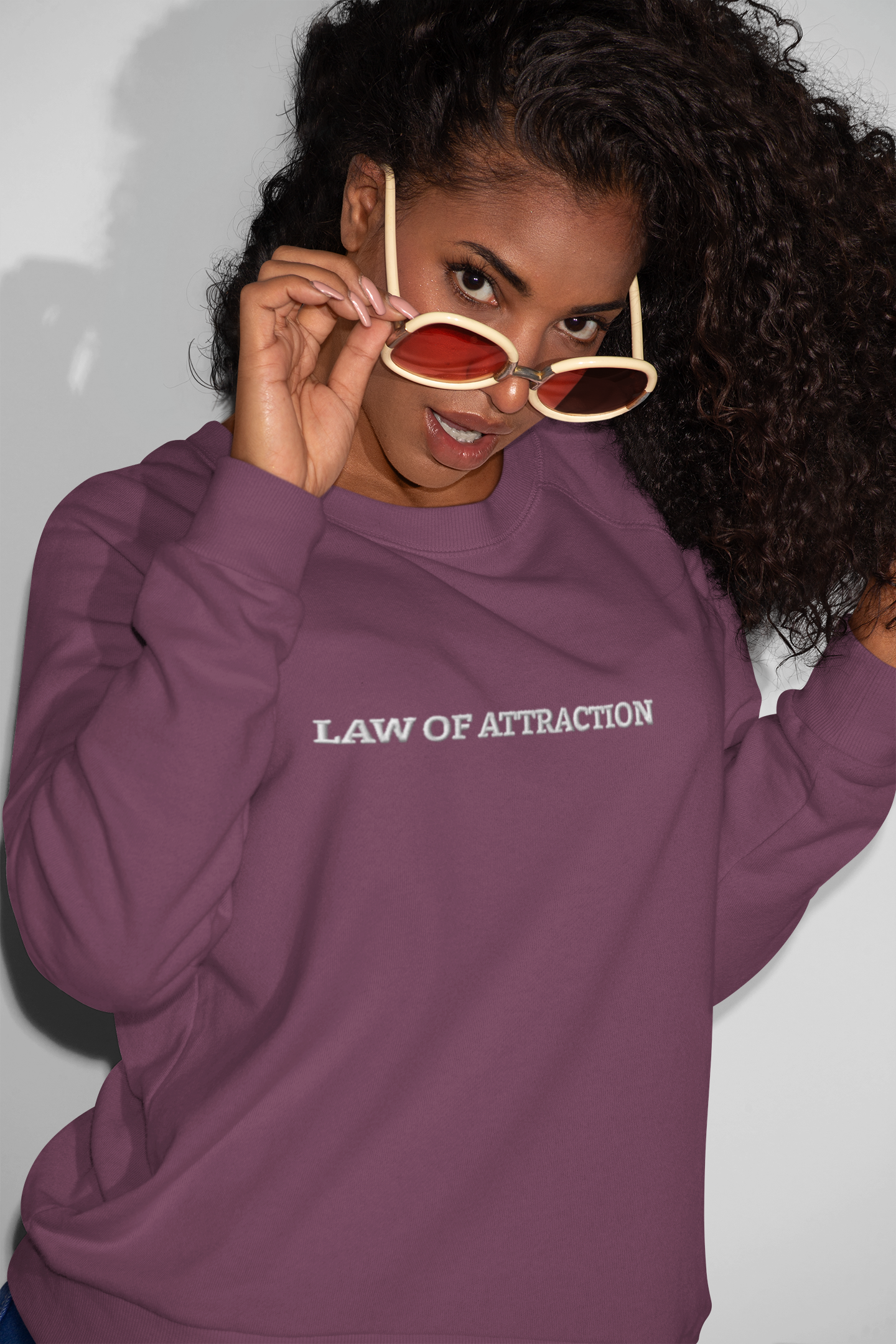 "LAW OF ATTRACTION" Design With White Embroidered Text. Classic Unisex Crewneck Sweatshirt Premium Quality Original Clothing. Wear Your Motivation